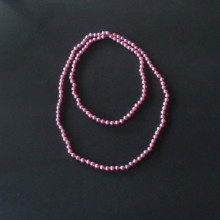 Collier de perles roses