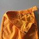 Déguisement Pantalon orange a paillettes Taille 22