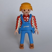 Un personnage PLAYMOBIL Homme avec salopette couleur Blanc rouge et Bleu de 1990