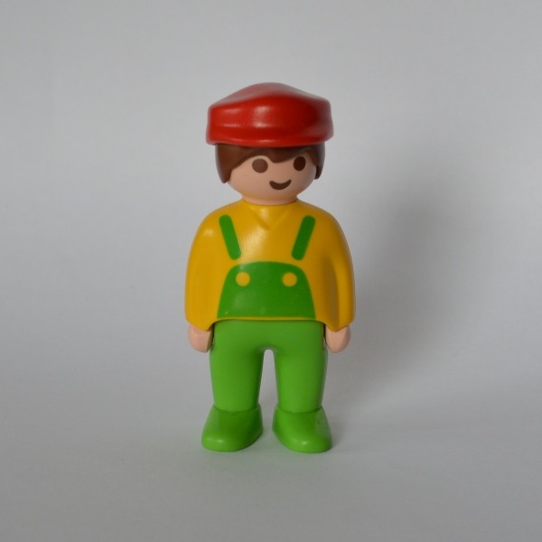 Un personnage modèle : Homme en salopette de la marque PLAYMOBIL 1990.